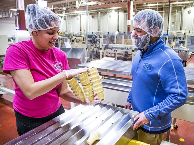 Hands-on quality assurance! These cone checkers have the best job – making sure your ice cream has the perfect home.