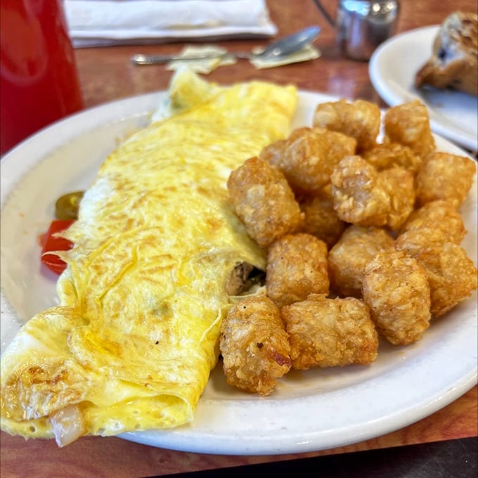 Eggs and tater tots: the dynamic duo of breakfast. This plate is what happens when your taste buds throw a party and invite all their favorite foods.