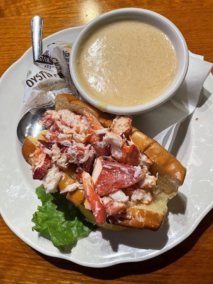 Lobster roll perfection! This beauty is packed with more meat than a bodybuilder's protein shake. Paired with creamy chowder, it's a match made in seafood heaven.