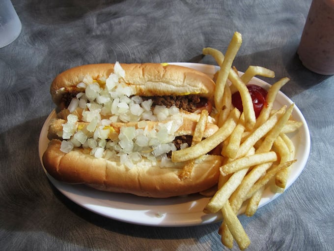 The classic combo that dreams are made of! Golden fries and a chili dog loaded with toppings – it's like a hug for your stomach.