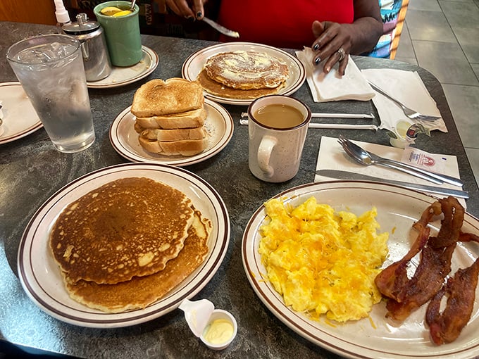 Stack 'em high! These pancakes are fluffier than a cloud and paired with coffee strong enough to wake Rip Van Winkle.