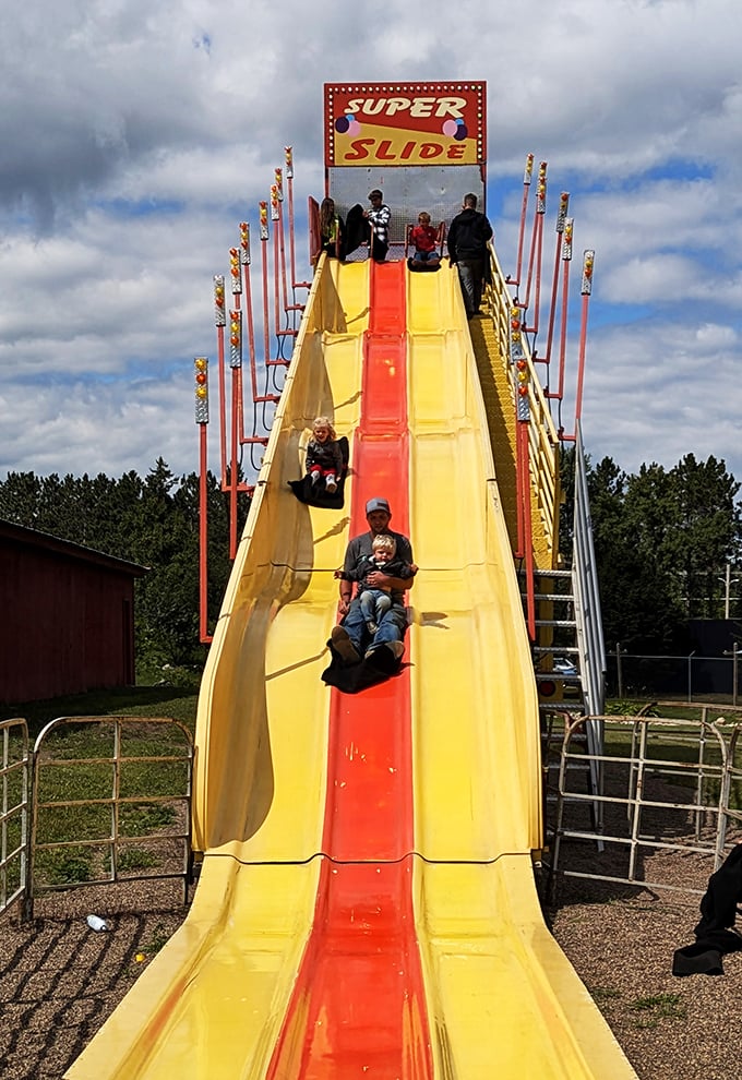 "Weeeee!" goes the crowd on the Super Slide. It's the closest you'll get to sledding in summer without angering the snow gods.