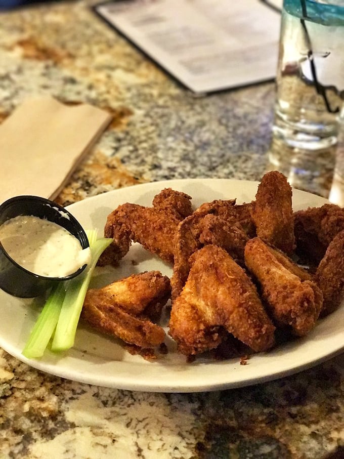 Wings so good, they'll make you wish you were born a bird. These crispy, saucy morsels are like tiny flavor bombs waiting to explode in your mouth.