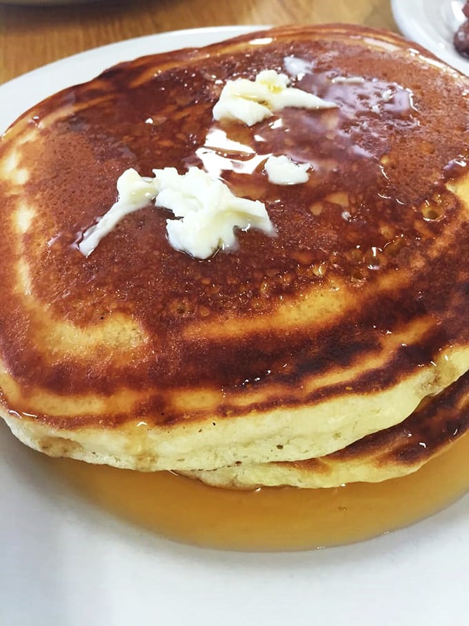 Pancakes so golden and fluffy, they could be mistaken for edible clouds. Drizzled with maple syrup, they're sweeter than a Hallmark movie marathon.