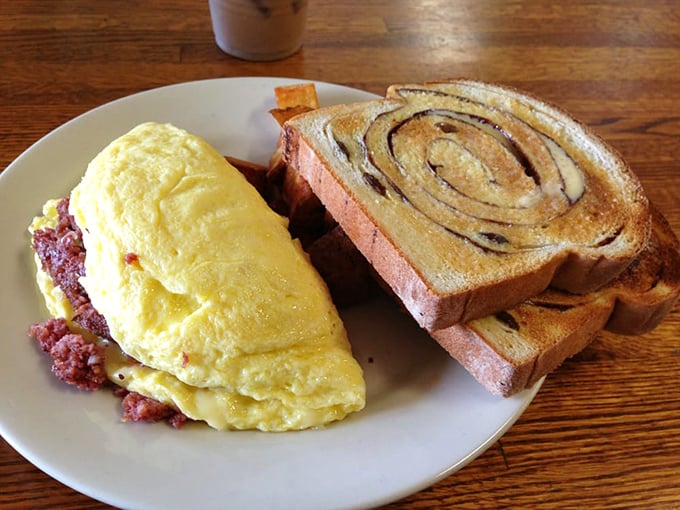 Omelette you in on a secret: this fluffy masterpiece is so good, it might just convince chickens to work overtime. Paired with cinnamon swirl toast, it's breakfast nirvana.