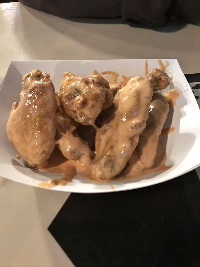 These wings aren't just food; they're a religious experience. Bathed in creamy sauce, they're the reason napkins were invented. Finger-licking good doesn't even begin to cover it.