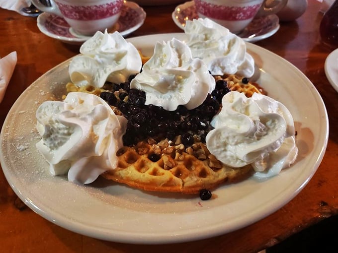 Waffle wonderland! This crispy canvas, adorned with berries and cream, is basically edible art. Van Gogh, eat your heart out (literally).