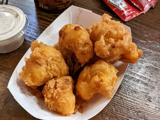 Golden nuggets of joy! These fried cheese curds are the crown jewels of Wisconsin cuisine – crispy on the outside, gooey on the inside, and utterly irresistible.