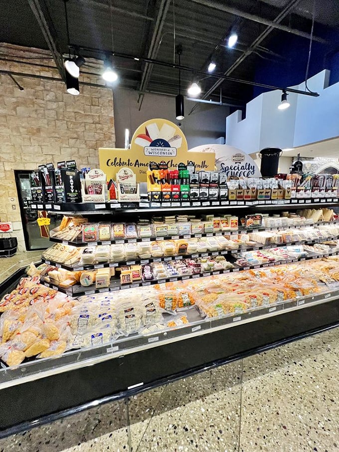 Cheese as far as the eye can see! This display is like a treasure map for your taste buds, each wedge a new adventure waiting to happen.