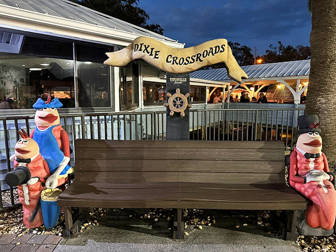 Seafood mascots on guard duty! Dixie Crossroads' quirky bench warmers promise a meal that's anything but crabby.