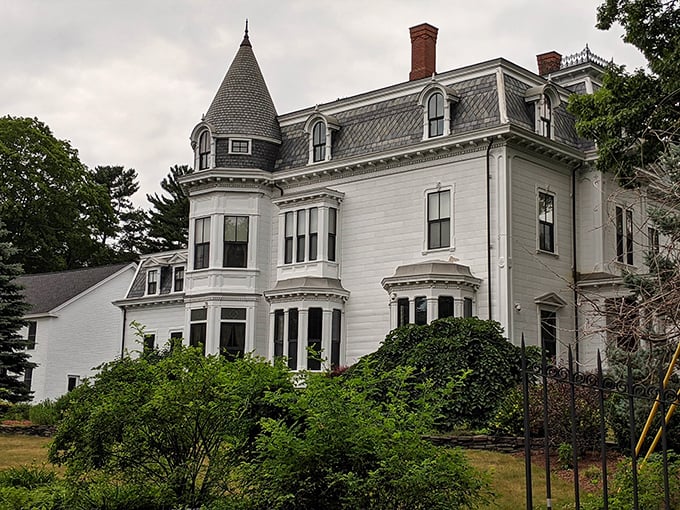 Forget white picket fences. This Victorian nightmare factory proves that bats and spiderwebs make the best lawn ornaments.