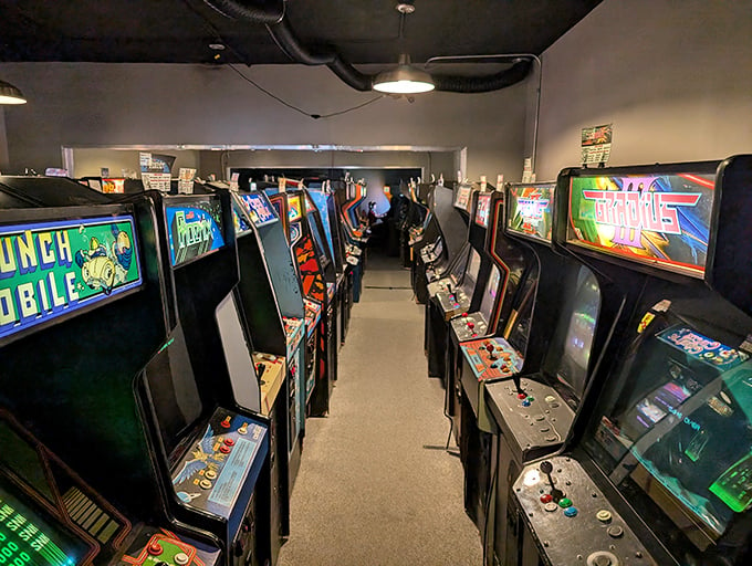 Galloping Ghost Arcade: Step into a pixelated paradise! Rows of arcade cabinets stretch as far as the eye can see, like a neon-lit field of digital dreams.