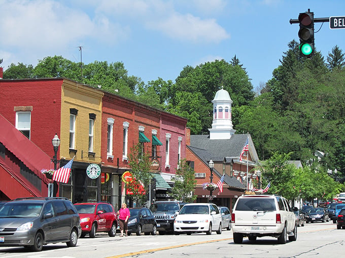 Main Street magic: Where Norman Rockwell meets Mayberry, with a dash of modern charm. American flags flutter proudly as shoppers stroll past quaint storefronts, creating a scene straight out of a nostalgic daydream.