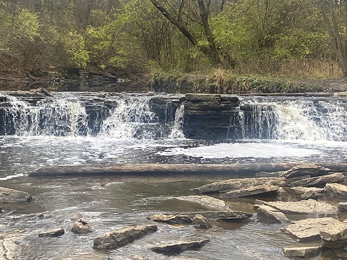 Nature's own water park! Rocky Glen Waterfall cascades over layered rocks, creating a serene oasis that's more refreshing than a glass of iced tea on a hot summer day.