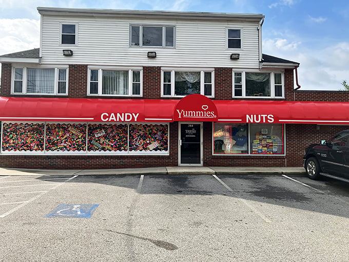 A candy lover's dream come true! Yummies Candy & Nuts beckons with its vibrant red awning, promising a sweet escape from the everyday grind.