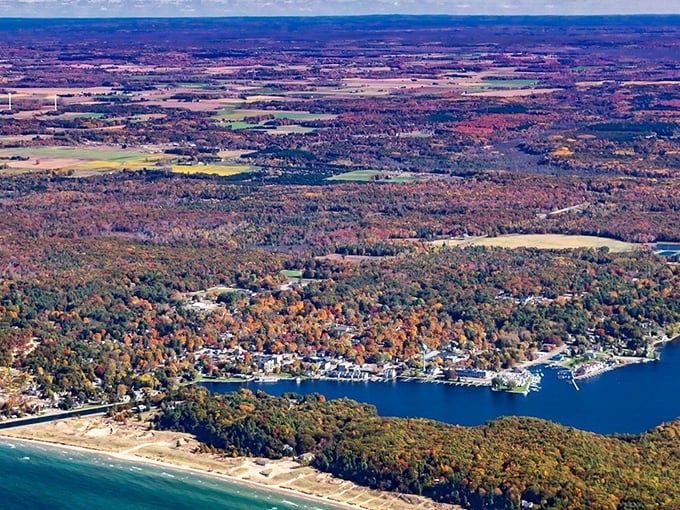 Pentwater: Where nature decided to show off and create a postcard-perfect town. This aerial view captures the essence of coastal living, complete with a marina that's basically boat heaven.