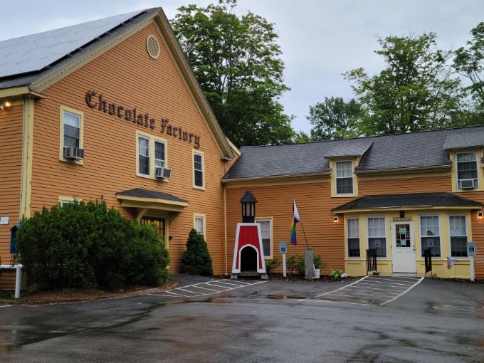 Welcome to chocolate heaven! This mustard-yellow building isn't just a factory, it's a portal to your sweetest childhood dreams.