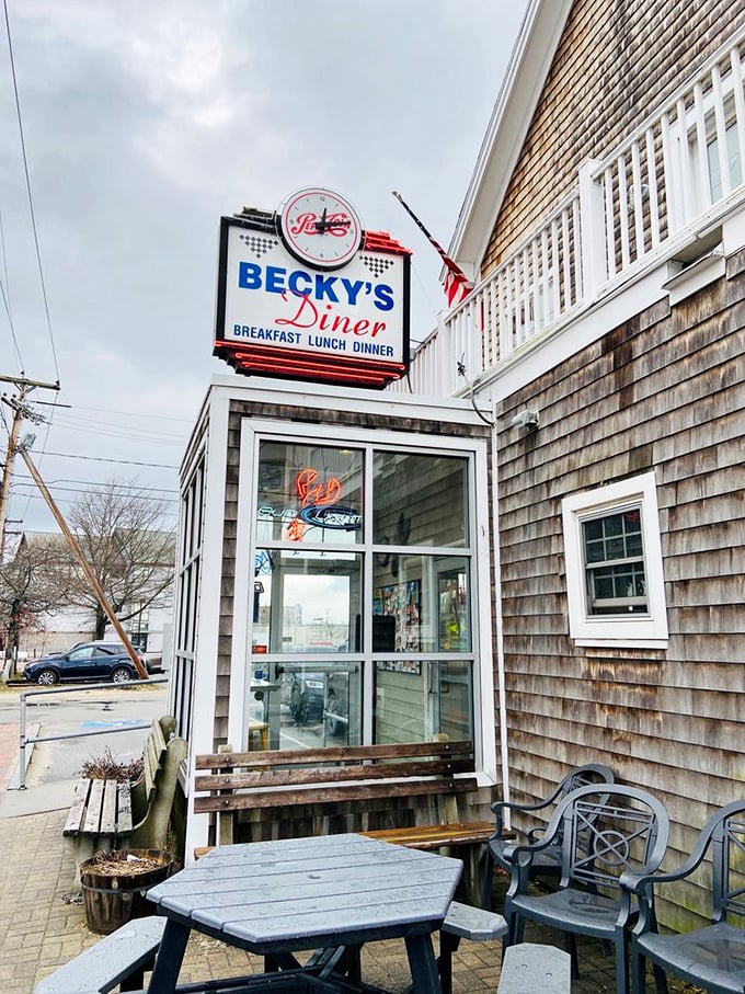 A weathered shingle exterior and classic neon sign welcome hungry souls to Becky's, where Maine hospitality meets timeless diner charm. Photo credit: Alyssa R.