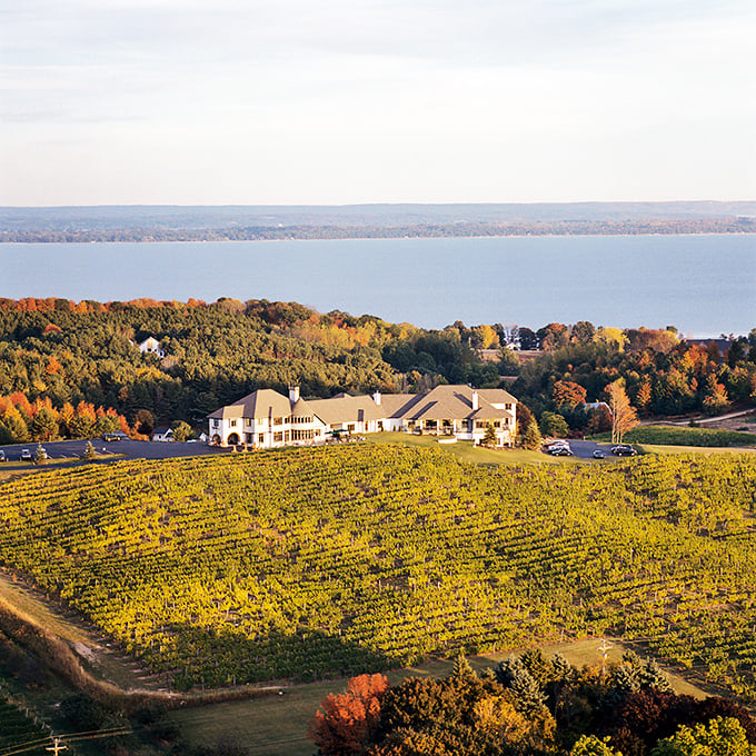 A postcard come to life! Chateau Chantal perches atop a hill like a crown jewel, surrounded by a sea of vines and that mesmerizing Michigan blue.