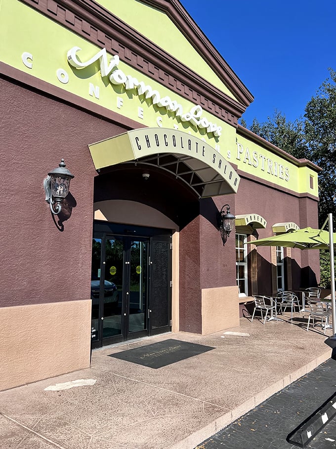 Welcome to chocolate heaven! Norman Love Confections' exterior promises a sweet escape, with its warm brown hues and pops of green beckoning chocolate lovers inside.