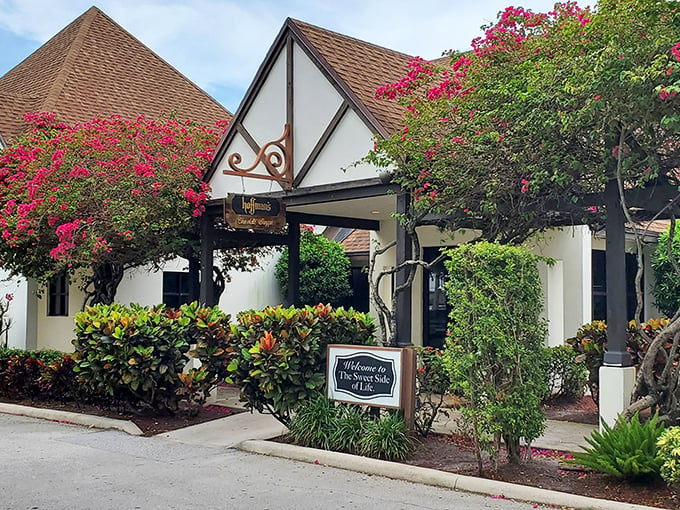 A chocolate lover's dream come true! Hoffman's Tudor-style facade promises sweet adventures within, framed by vibrant bougainvillea.